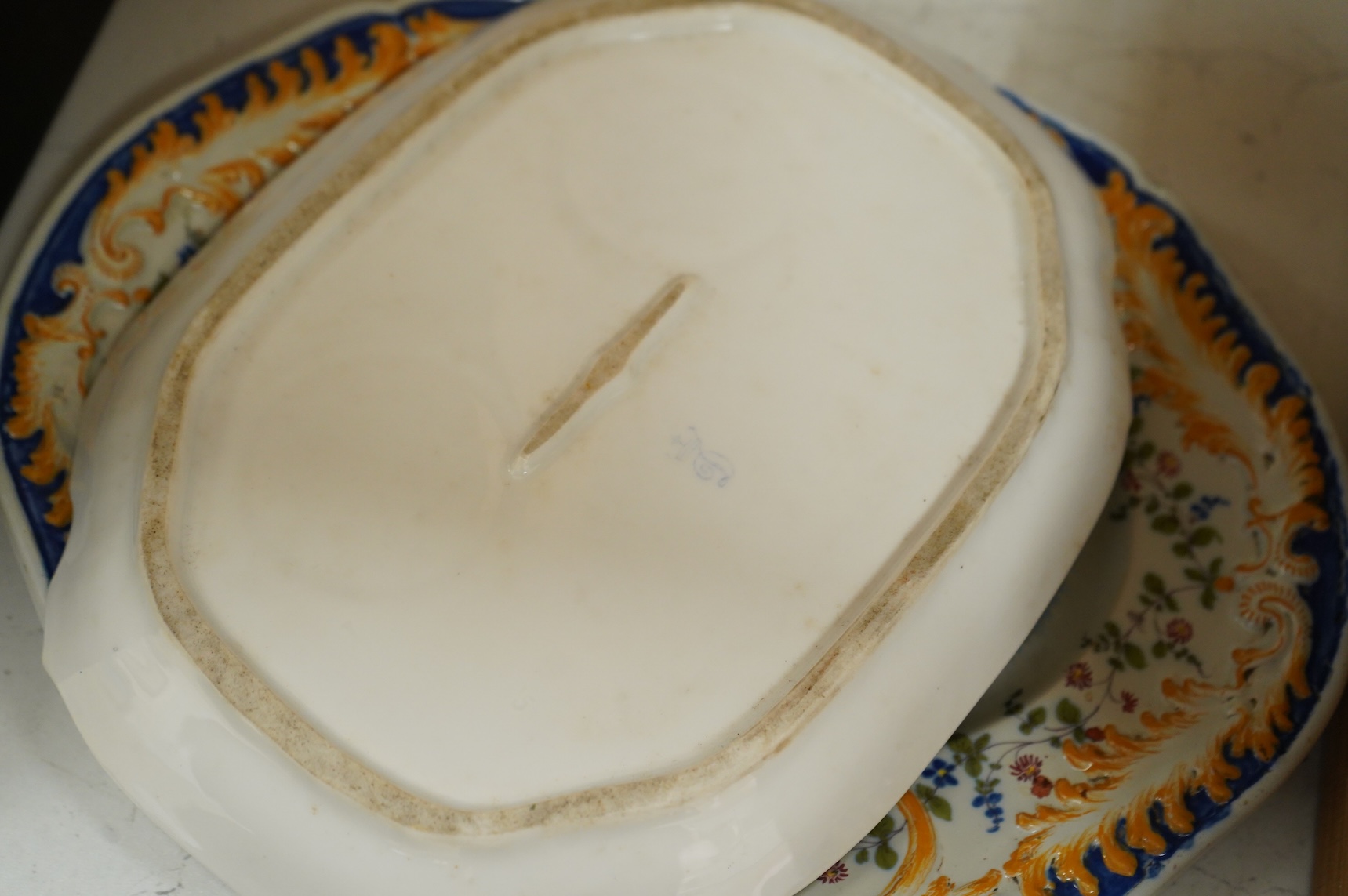 A late 19th century Dresden ink stand and a pair of candlesticks and a Nove faience dish
